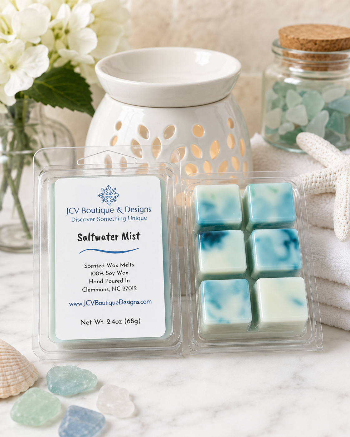 Packaged saltwater mist wax melts with a wax warmer and decorative items in the background.